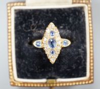 An Edwardian 18ct gold, sapphire and diamond set marquise set cluster ring, size K, gross weight 3.2
