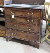 A small George III mahogany chest of three graduating long drawers and fitted slide, width 79cm,
