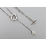 A modern 750 white metal and diamond cluster set drop necklace, 54cm, gross weight 10 grams.