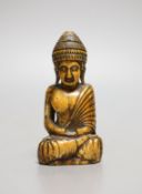 A Thai ivory buddha, probably 8th / 9th century,9cms high.