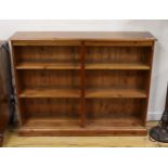 A modern pine open fronted bookcase, length 130cm, depth 29cm, height 100cm