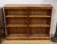 A modern pine open fronted bookcase, length 130cm, depth 29cm, height 100cm