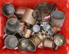 A quantity of copper cups and jugs