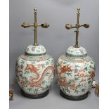 A pair of 19th century Chinese famille verte’dragon’ jars and covers (drilled and converted to