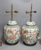 A pair of 19th century Chinese famille verte’dragon’ jars and covers (drilled and converted to