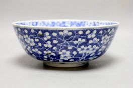 A Chinese blue and white prunus bowl, 19th century. 26.5cm diameter