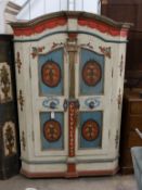 An early 19th century Tyrolean painted pine armoire, width 122cm, depth 62cm, height 186cm