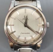 A gentleman's stainless steel Omega Seamaster Automatic wrist watch, on a stainless steel Omega