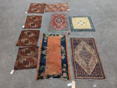 Nine Afghan, Persian and Chinese rug fragments.