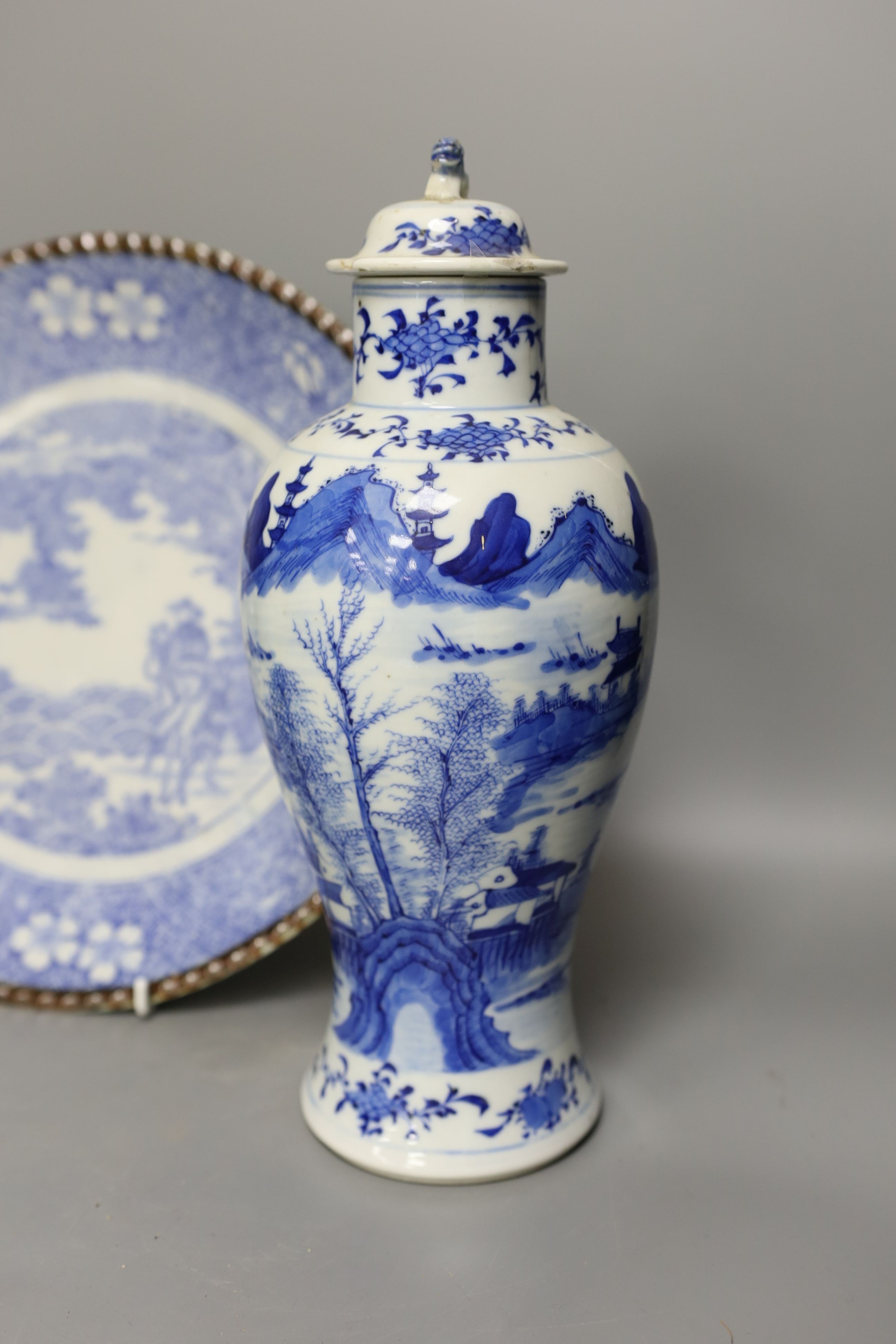An early 20th century Chinese blue and white lidded vase together with a similar enamelled pottery - Image 2 of 6