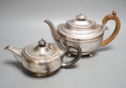 A George III silver teapot, Soloman Hougham, London, 1816 and a 20th century squat silver teapot,