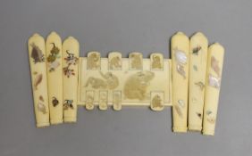 A carved ivory Japanese bezique marker and six Shibayama style ivory handles, Meiji period marker