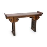 A Chinese elm and cypress wood altar table, 17th/18th Century,the panelled top with shaped ends