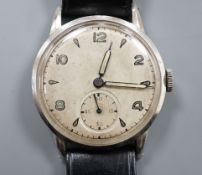 A gentleman's stainless steel manual wind wrist watch, the case and movement signed Rolex, on