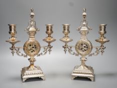 A pair of Winn & Co., Birmingham silvered brass two branch candelabra - 28.9cm high