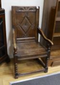 A late 17th century and later Halifax oak panel back armchair, width 52cm, depth 44cm, height 98cm