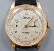 A gentleman's 1950's? 18k yellow metal Exactus manual wind chronographe wrist watch, on a black