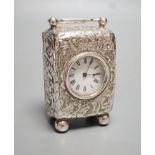 A late Victorian embossed silver cased miniature carriage timepiece, maker G.B, London, 1894, on bun