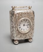 A late Victorian embossed silver cased miniature carriage timepiece, maker G.B, London, 1894, on bun