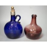 A Victorian blue glass claret jug and an amethyst glass bottle, tallest 23cm