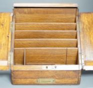 A Victorian oak stationery box with original fittings