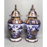 A pair of mid 19th century ironstone vases and covers - 51cm tall