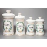 Four graduated porcelain apothecary jars - tallest 26cm