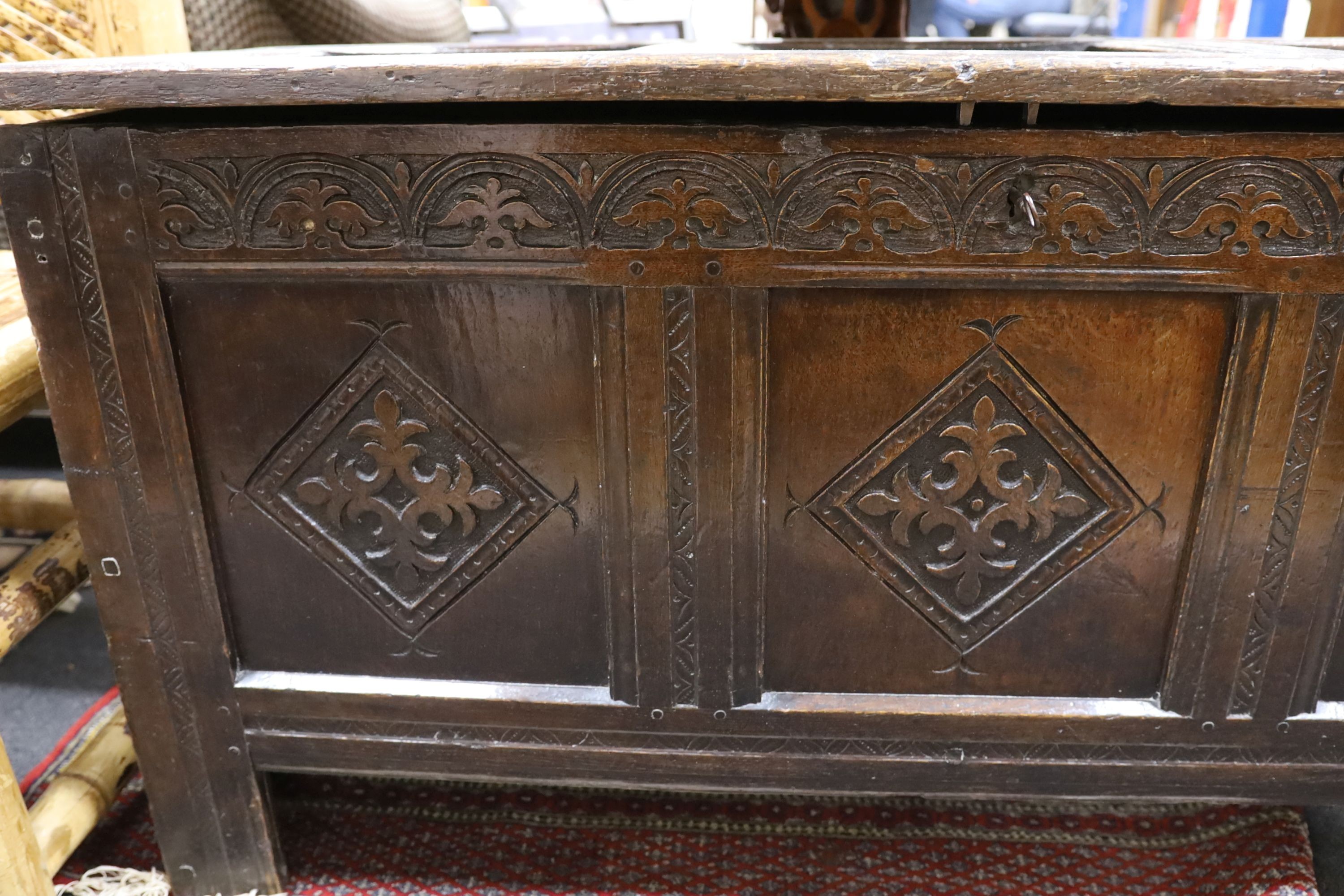 A late 17th century carved oak coffer, length 134cm, depth 54cm, height 68cm - Image 4 of 6