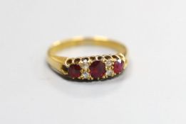 A late Victorian 18ct gold, three stone ruby and four stone diamond set half hoop ring, size M,