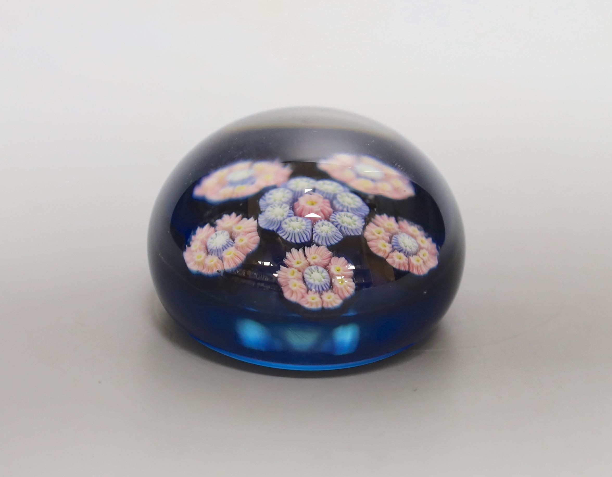 A small Perthshire blue ground millefiori glass paperweight - 6cm diameter