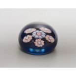 A small Perthshire blue ground millefiori glass paperweight - 6cm diameter