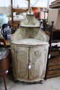 An 18th century Italian painted carved pine bow front standing corner cabinet, width 64cm, depth