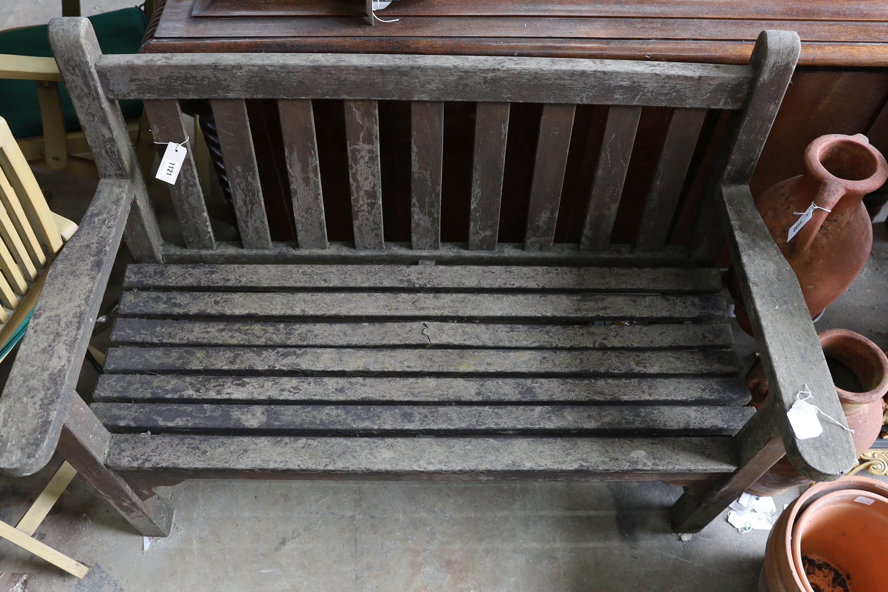A weathered teak slatted garden bench, length 128cm, depth 62cm, height 91cm - Image 2 of 3