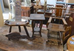 A small child's oak rocking chair, a pair of carved wood bellows and two caned tables