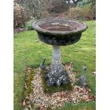 A circular reconstituted stone bird bath, diameter 56cm, height 89cm