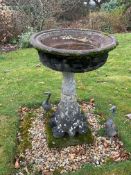 A circular reconstituted stone bird bath, diameter 56cm, height 89cm