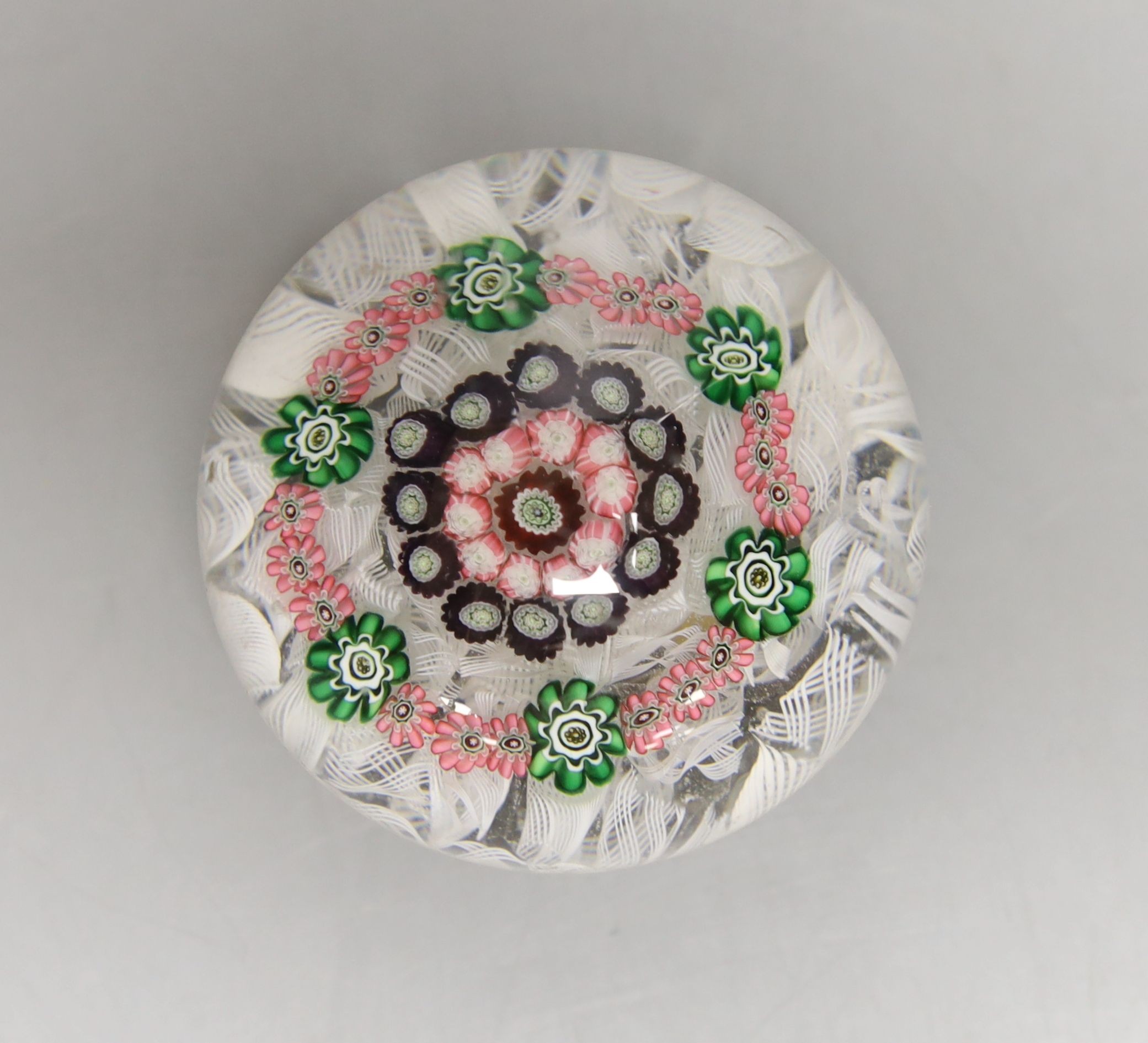 A mid 19th century French concentric millefiori glass paperweight, with scrambled latticino ground - Image 2 of 3