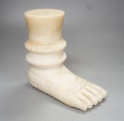 An Indian white marble foot of a deity - 18cm high