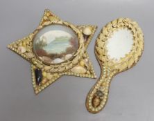 A shell mounted star with central scenic seascape and a shell hand mirror, star 24 cms wide.