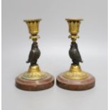 A pair of bronze and ormolu owl candlesticks - 16.5cm tall