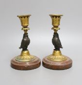 A pair of bronze and ormolu owl candlesticks - 16.5cm tall