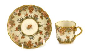 A Japanese Satsuma pottery cup and saucer, signed Seikozan, Meiji period,painted with flowers and