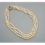 A triple strand cultured pearl choker necklace, with a yellow metal, amethyst and cultured pearl set