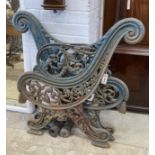 A pair of Victorian Coalbrookdale style painted cast iron bench ends, height 85cm