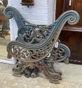 A pair of Victorian Coalbrookdale style painted cast iron bench ends, height 85cm