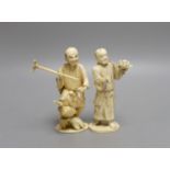 Two Japanese sectional ivory figures of farmers, early 20th century - tallest 13.5cm