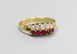 A late Victorian 18ct gold, graduated five stone ruby and five stone diamond set twin row ring, size