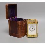 A French brass cased carriage timepiece with case. 11cm
