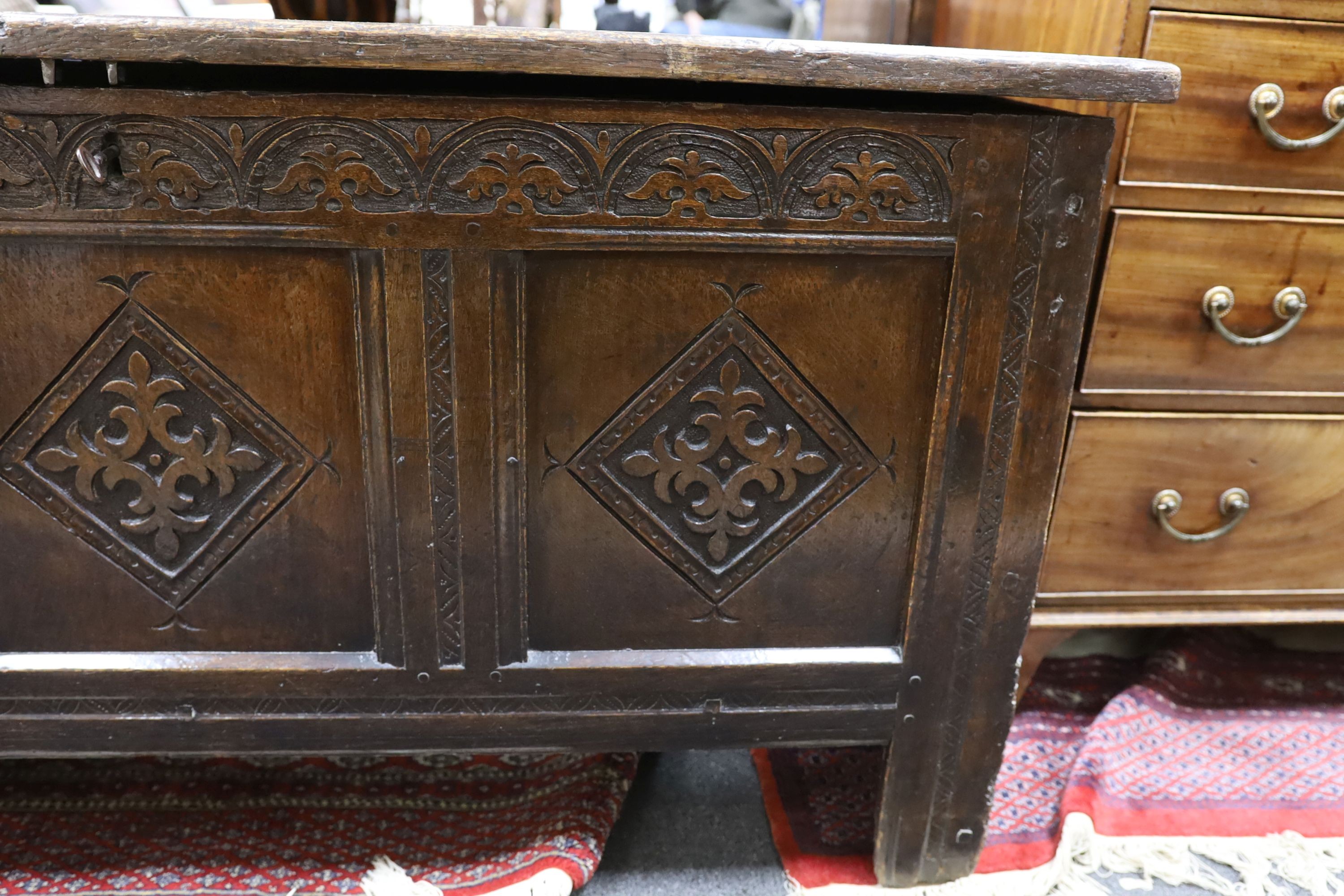 A late 17th century carved oak coffer, length 134cm, depth 54cm, height 68cm - Image 3 of 6