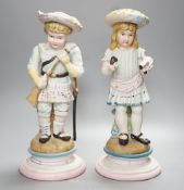 A pair of Continental coloured bisque figures of children - 39cm high